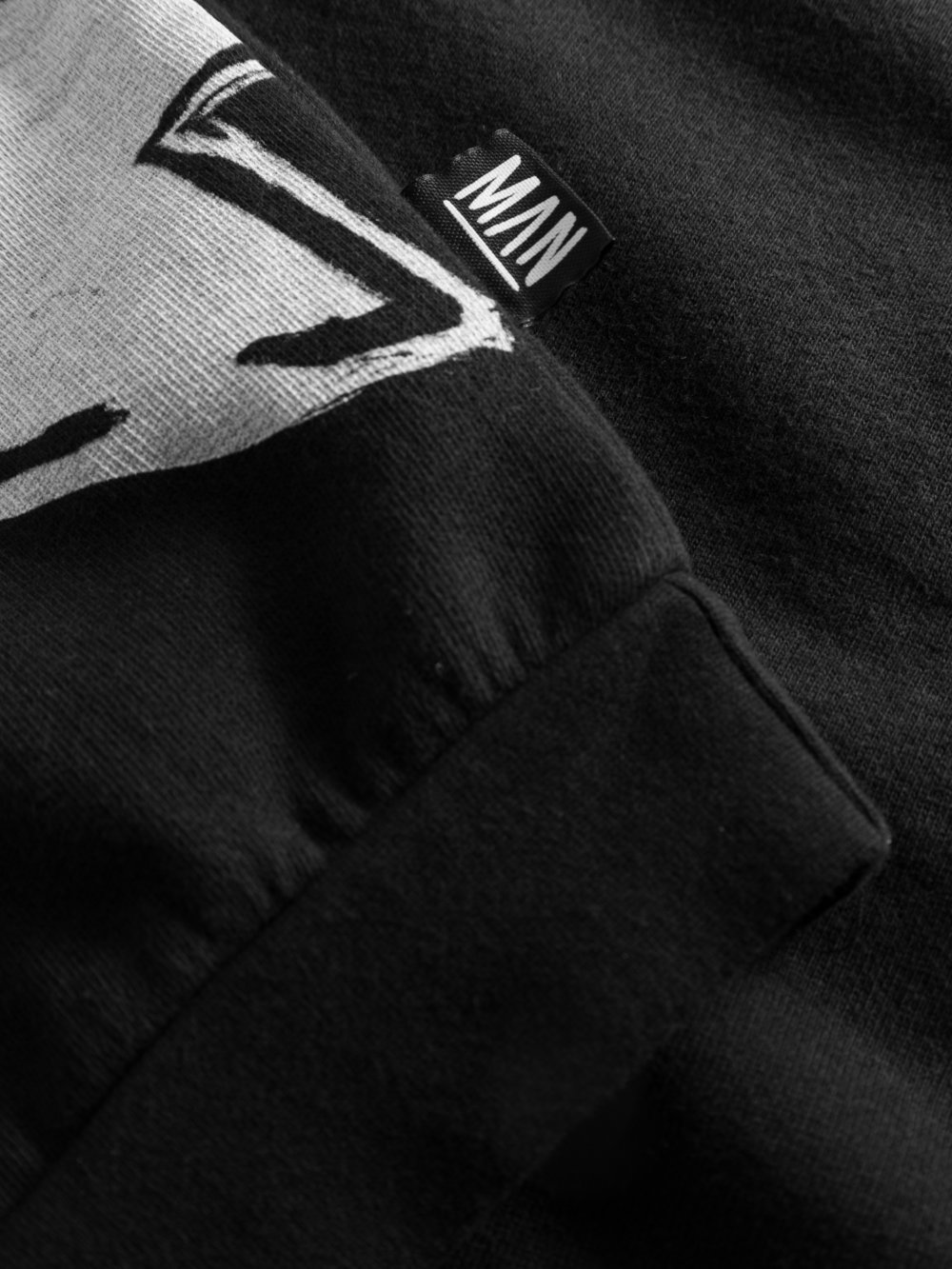 black unisex sweater detail label