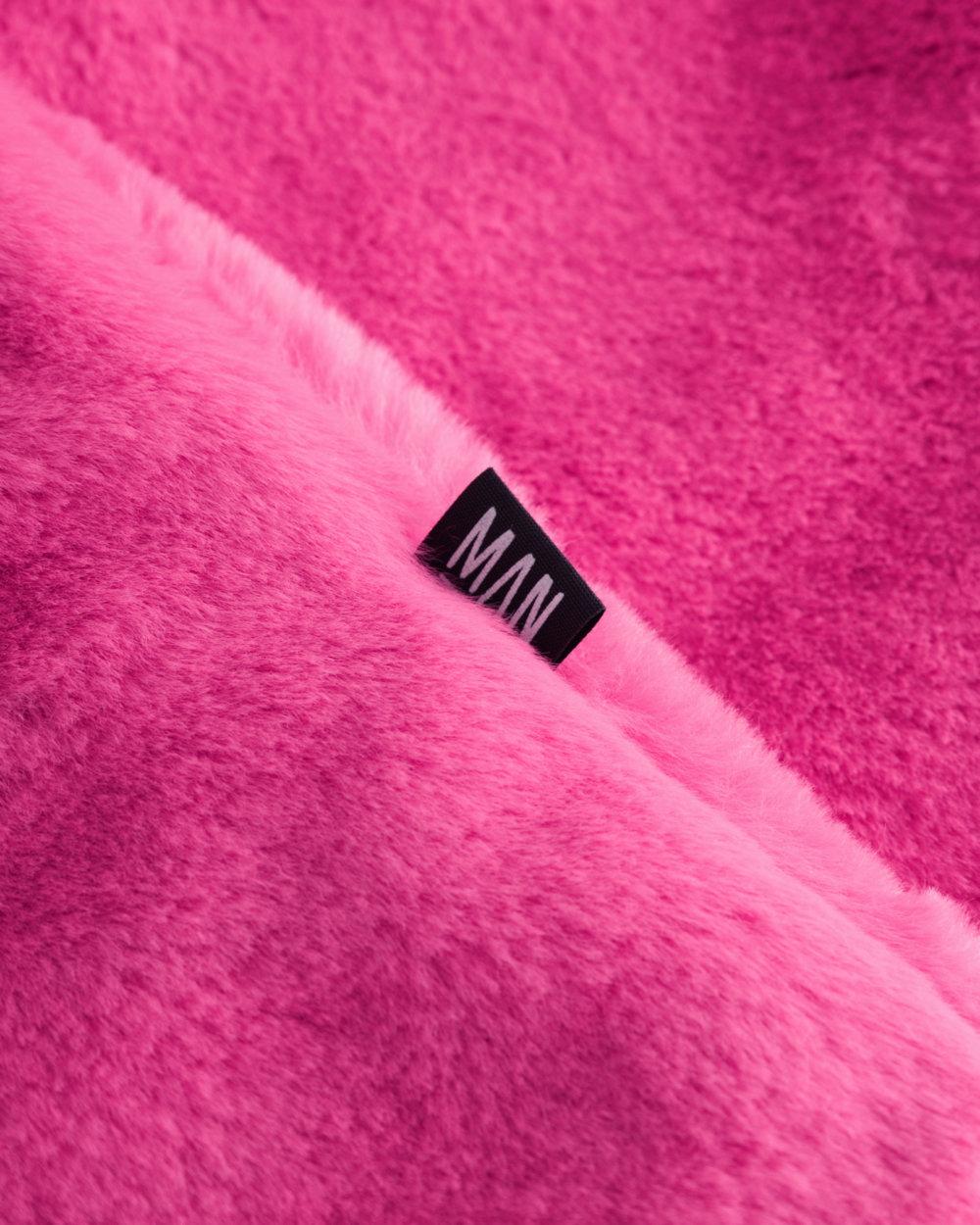 pink fluffy coat detail label