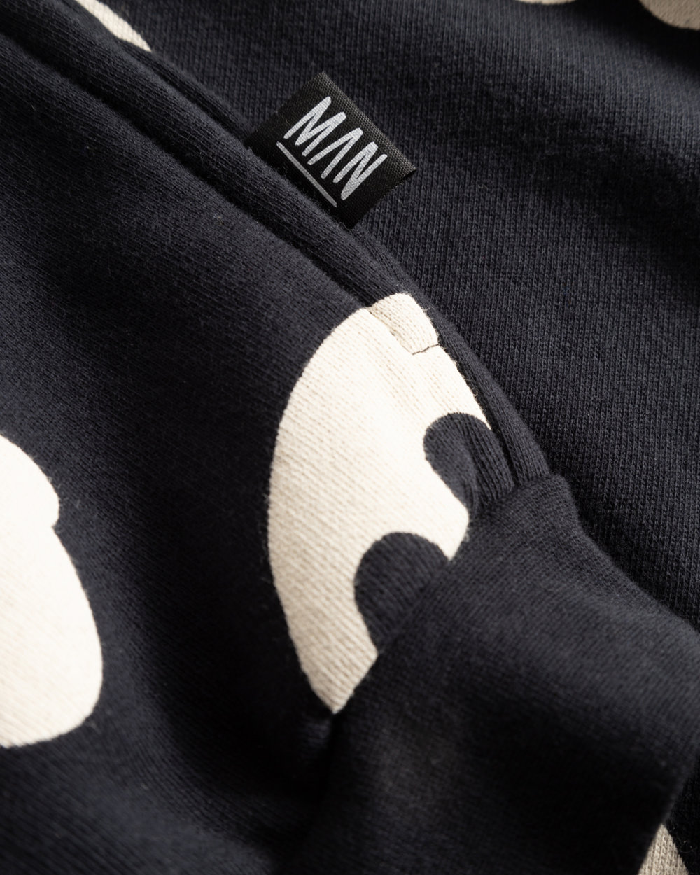 black hoodie jacket detail label