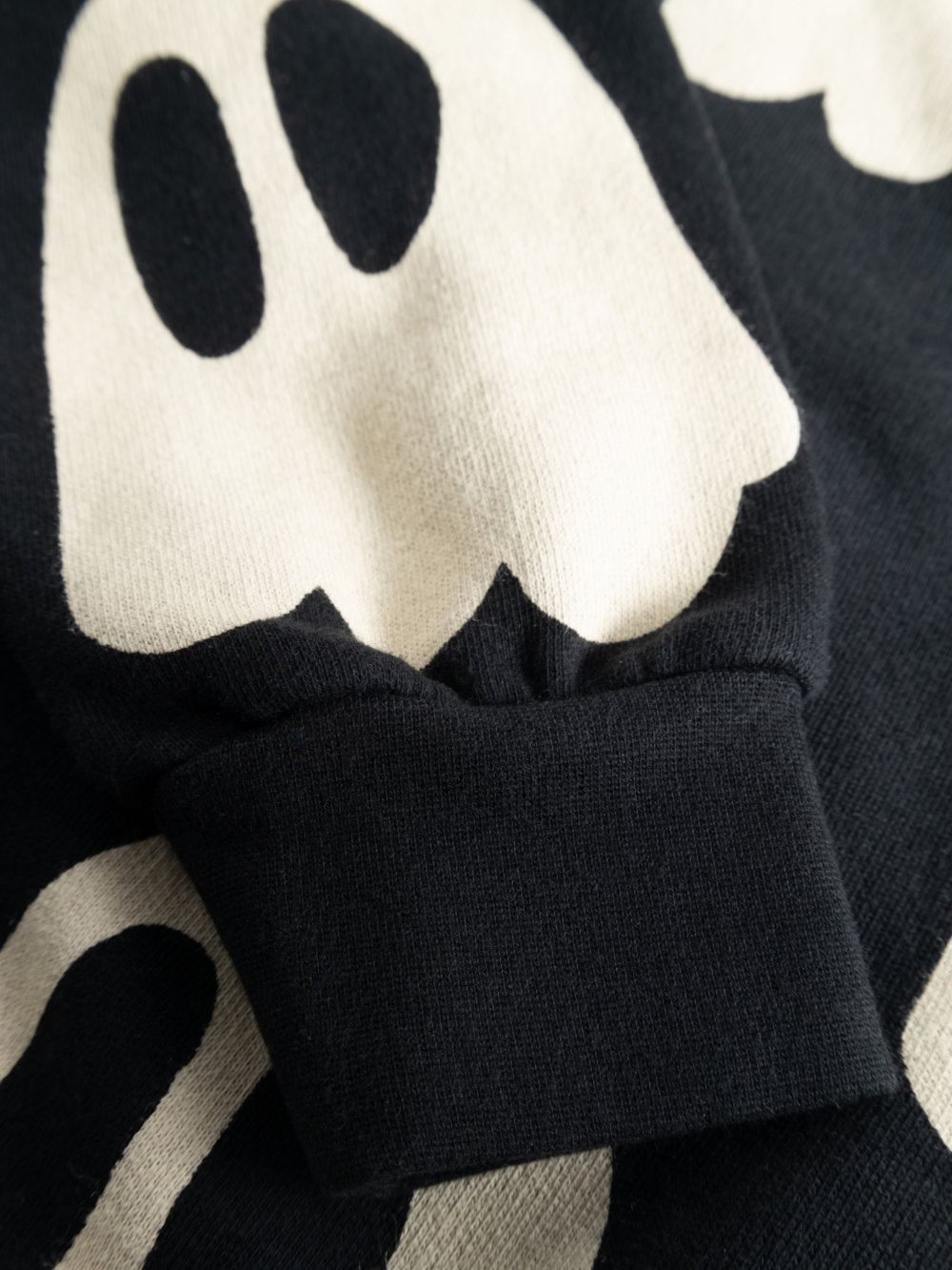 black organic sweater detail print