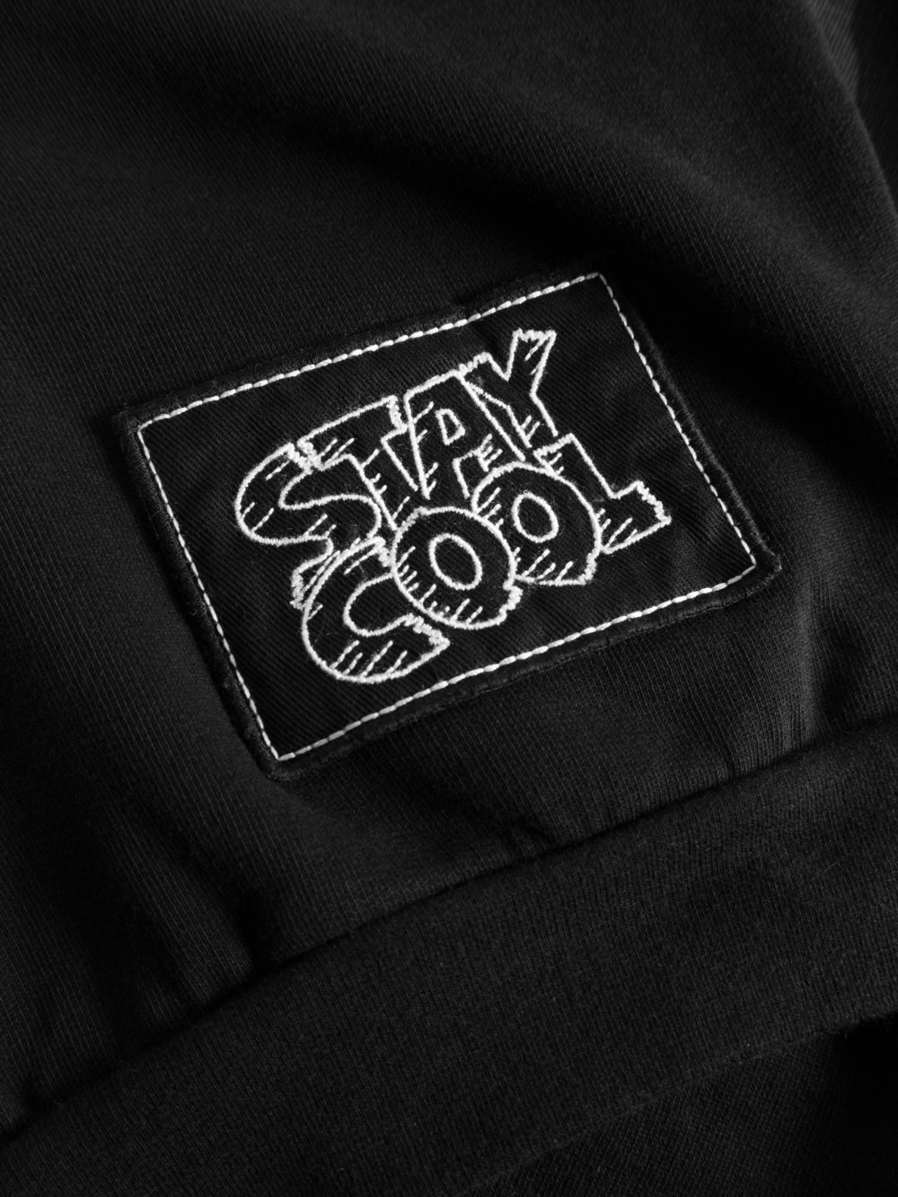 black unisex hoodie detail patch